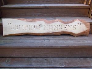 Click to enlarge image  - HANDCRAFTED WOOD SIGN - JUMPING MONKEYS